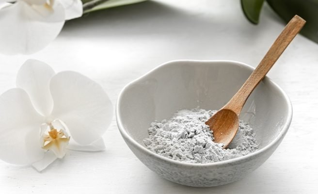 clay in a bowl with spoon