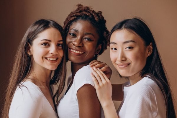 Three multicultural girls together at studio