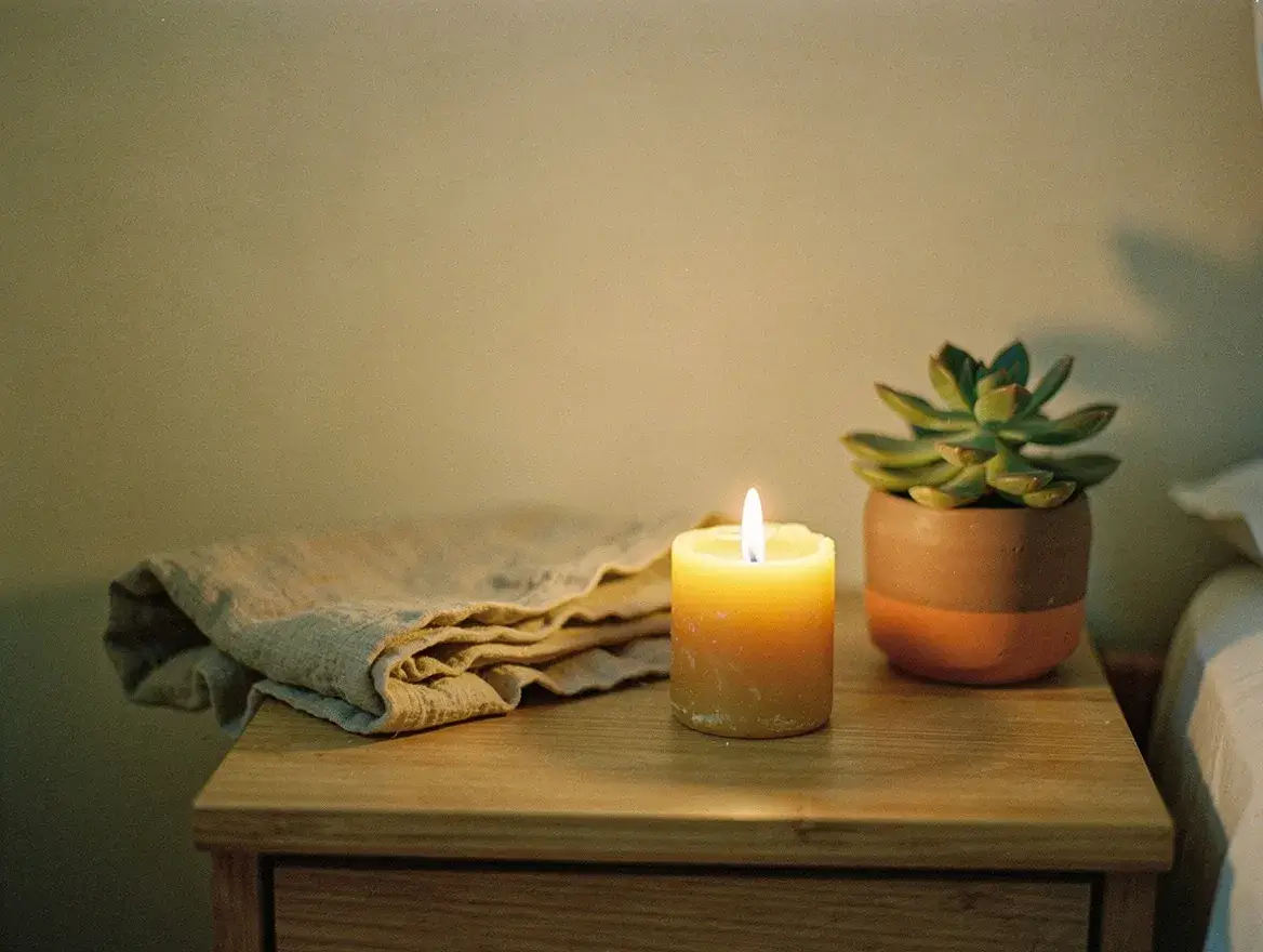 natural candle wellness ritual evening bedroom