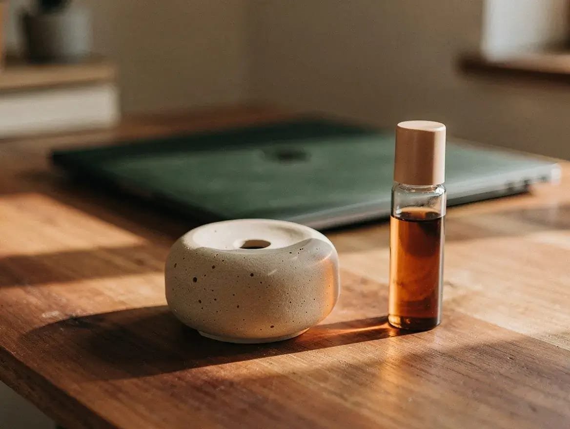 using an essential oil diffuser and roller for focus